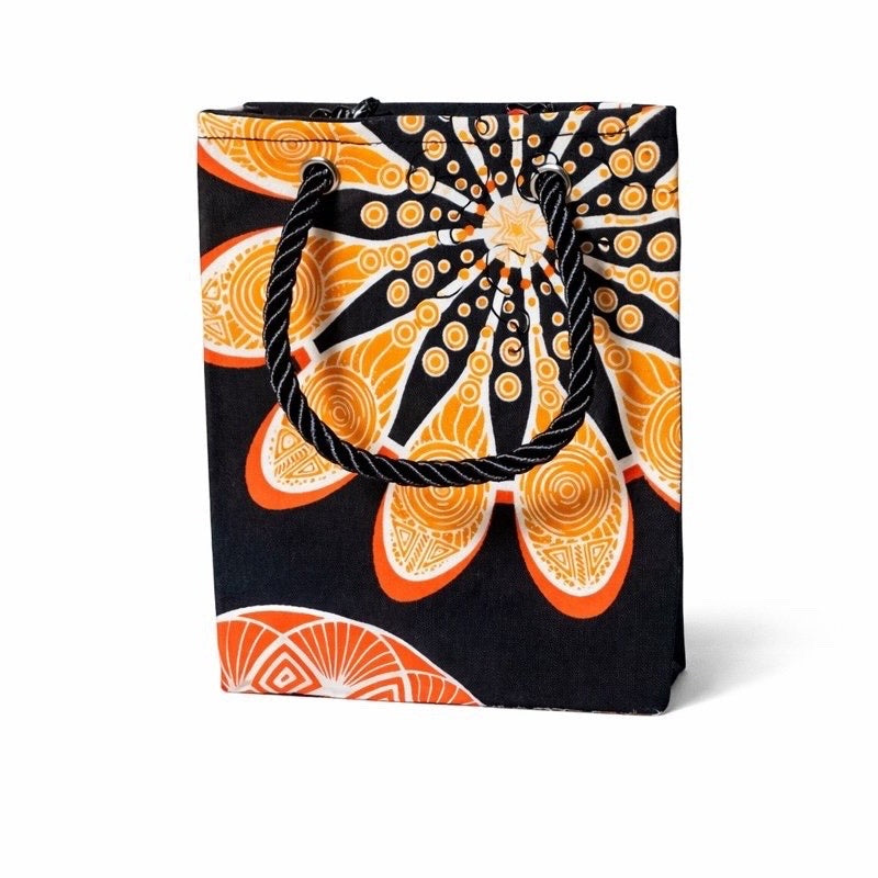 Black mini gift bag with orange and white abstract pattern on a white background