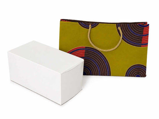 Green, dark brown, blue, red, and gold patterned bag with a white box on a white background