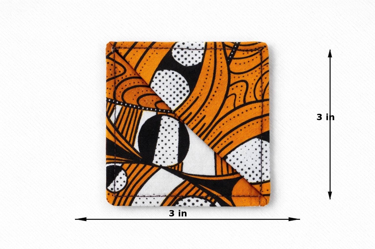 Orange, black, & white corner bookmark with abstract design 3x3 dimensions shown on a light gray background
