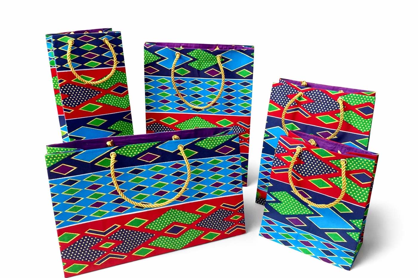 Dark purple, green, red, turquoise, & gold medium horizontal bag, wine bag, medium, small, and extra small gift bag on a white background
