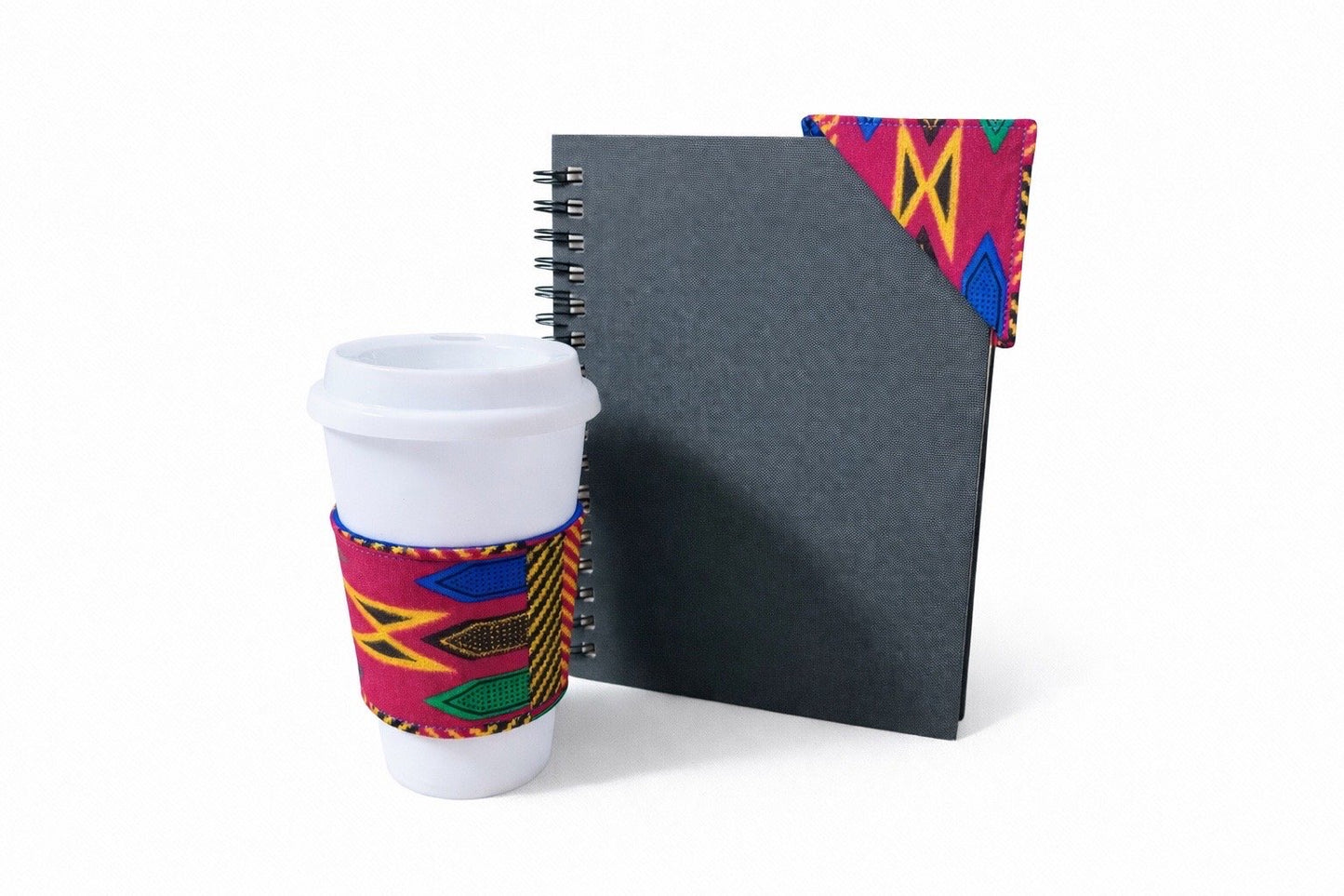 Fuscia, green, blue, brown, and gold cup sleeve & corner bookmark on a white background