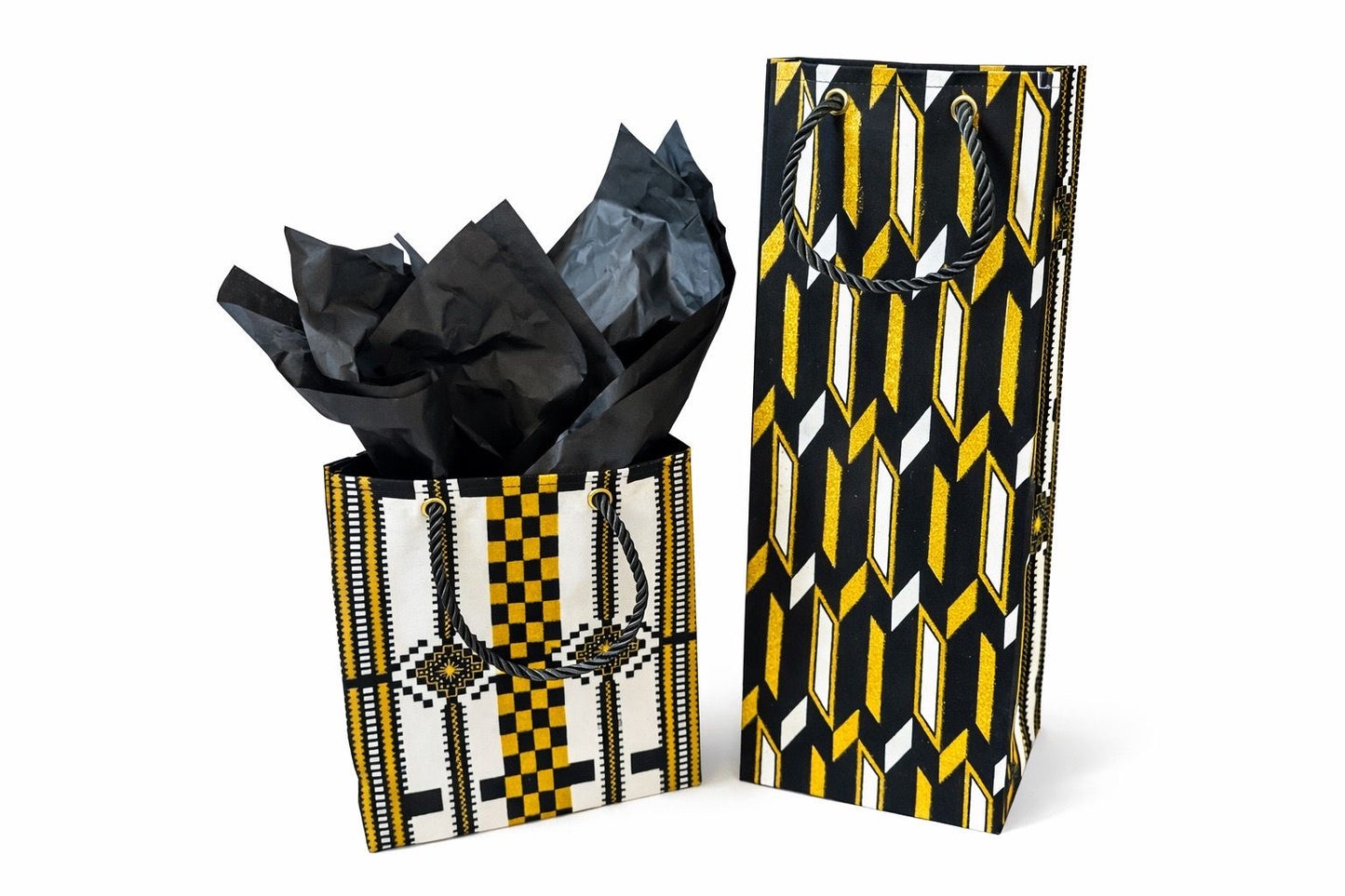 White, black, & gold extra small bag with black tissue paper & wine bag on a white background