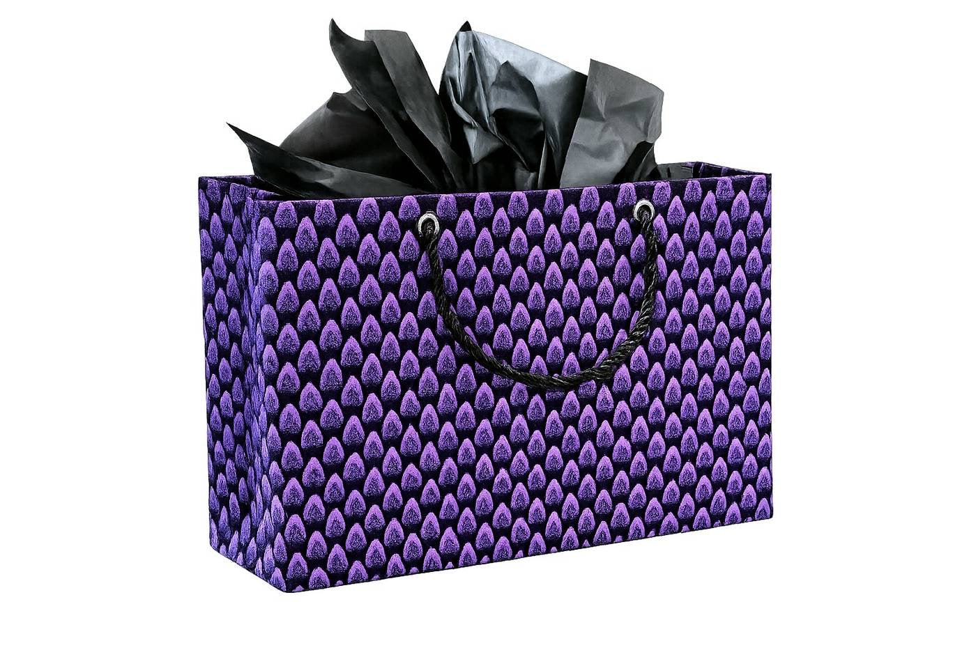Purple gift bag with black pattern and black tissue paper on a white background