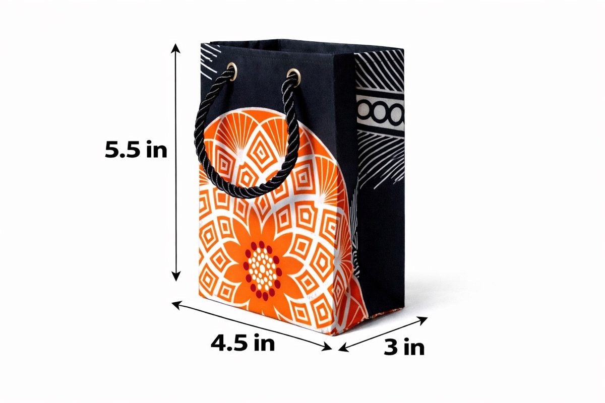 Black, orange, & white mini gift bag with abstract design 5.5H in x 4.5W in x 3D in dimensions shown on a white background
