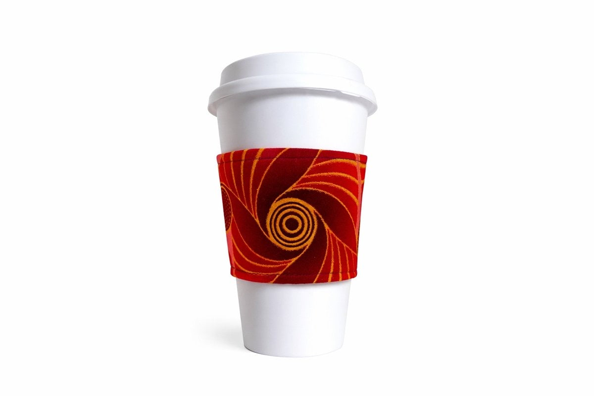 Maroon, pink, red, & gold African wax print cup sleeve on coffee cup