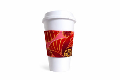 Maroon, pink, red, & gold African wax print cup sleeve on coffee cup