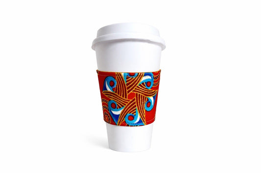 Red, blue, white, & gold African wax print cup sleeve on coffee cup