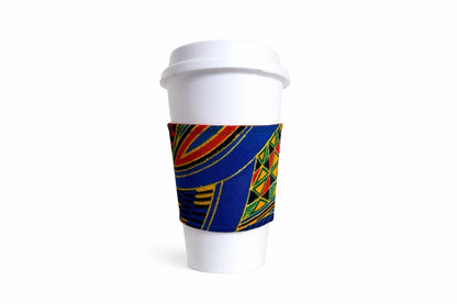 Royal blue, green, red, orange, yellow, black, & gold African wax print cup sleeve on coffee cup