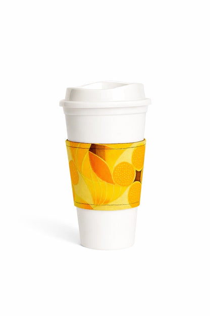 Yellow, brown, orange & gold African wax print cup sleeve on coffee cup