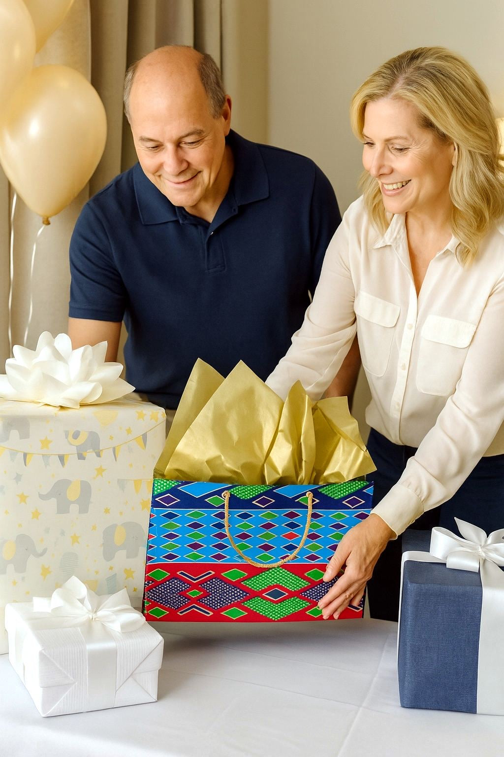 Man and woman opening a gift together with balloons in the background