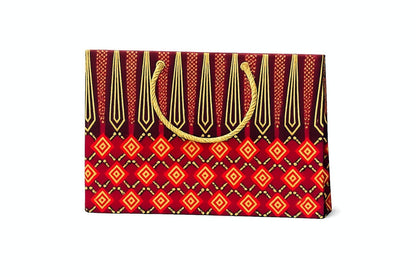 Horizontal gift bag with maroon, red and gold pattern on a white background