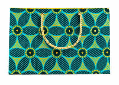 Green, dark green, and gold decorative bag with gold handle on a white background