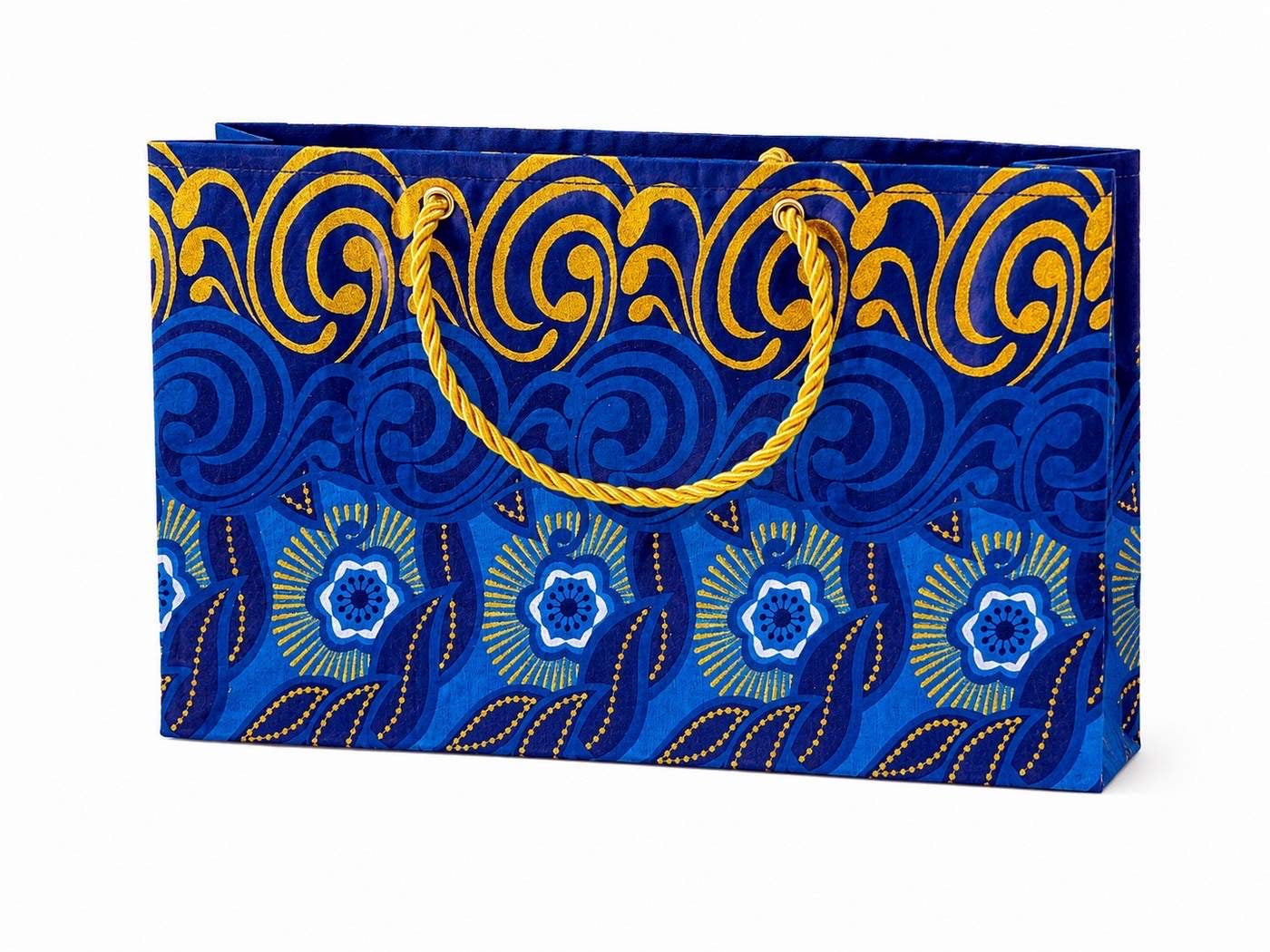 Decorative gift bag with blue, dark blue, white, and gold patterns on a white background