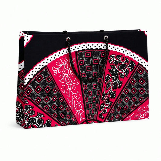 Black, fuchsia, and white patterned bag on a white background