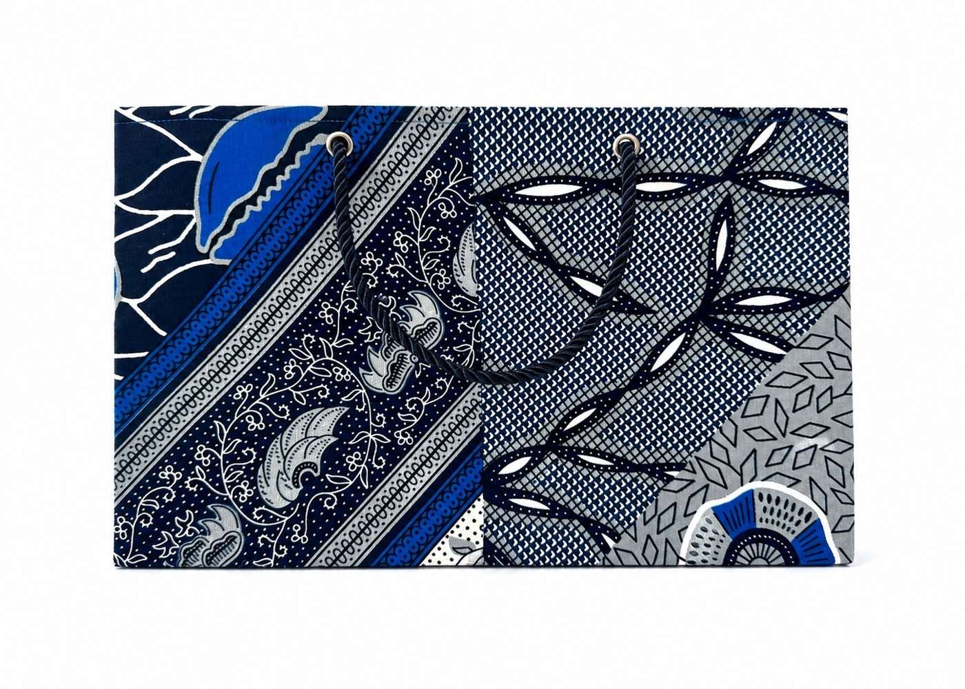 Decorative gift bag with blue, white, and white pattern on a white background