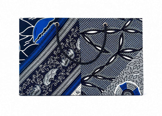 Decorative gift bag with blue, white, and white pattern on a white background
