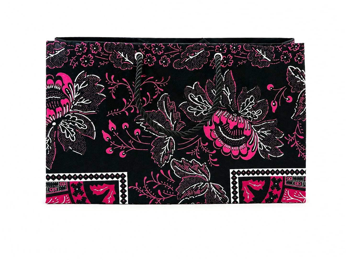 Floral patterned black, white, and fuchsia gift bag on a black background