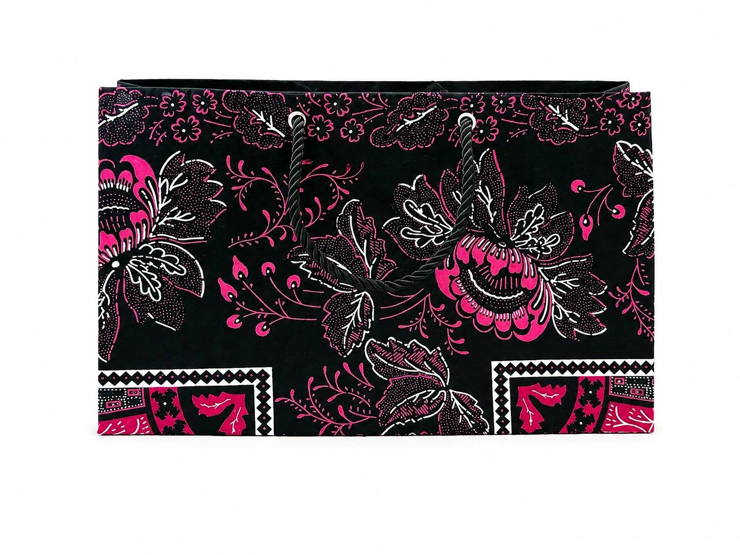 Floral patterned black, white, and fuchsia gift bag on a black background