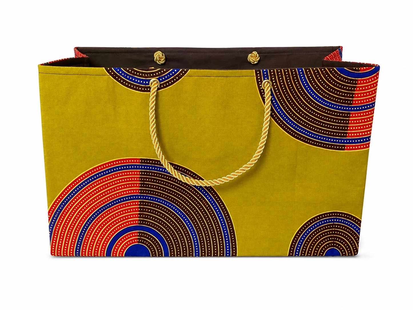 Decorative gift bag with green, dark brown, red, blue, and gold pattern on a white background