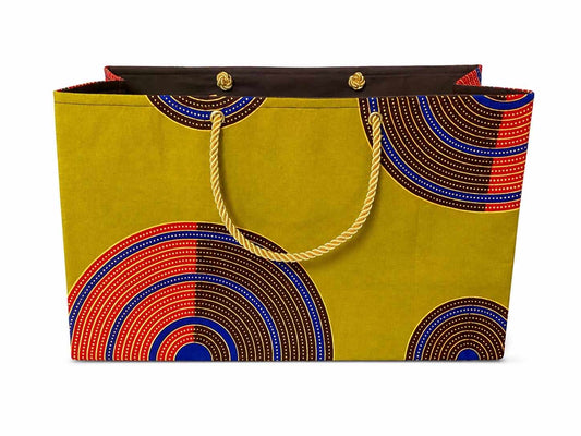 Decorative gift bag with green, dark brown, red, blue, and gold pattern on a white background