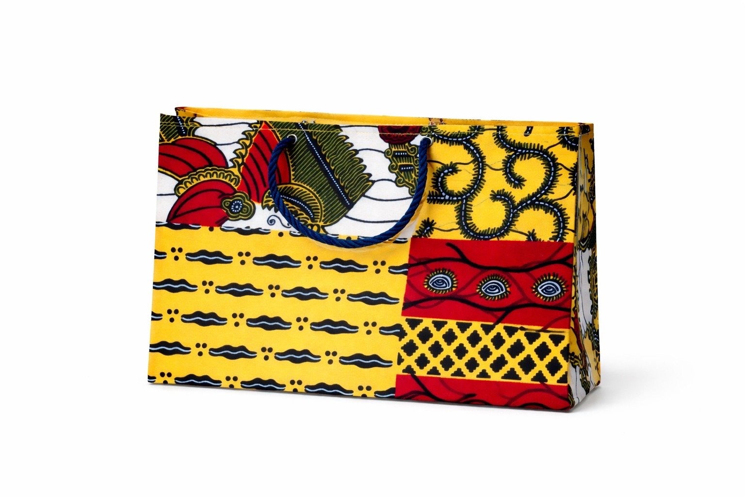 Decorative, ethnic, fabric, handmade, patterned gift bag with Yellow, Red, Dark Blue, and white patterns, on a white background