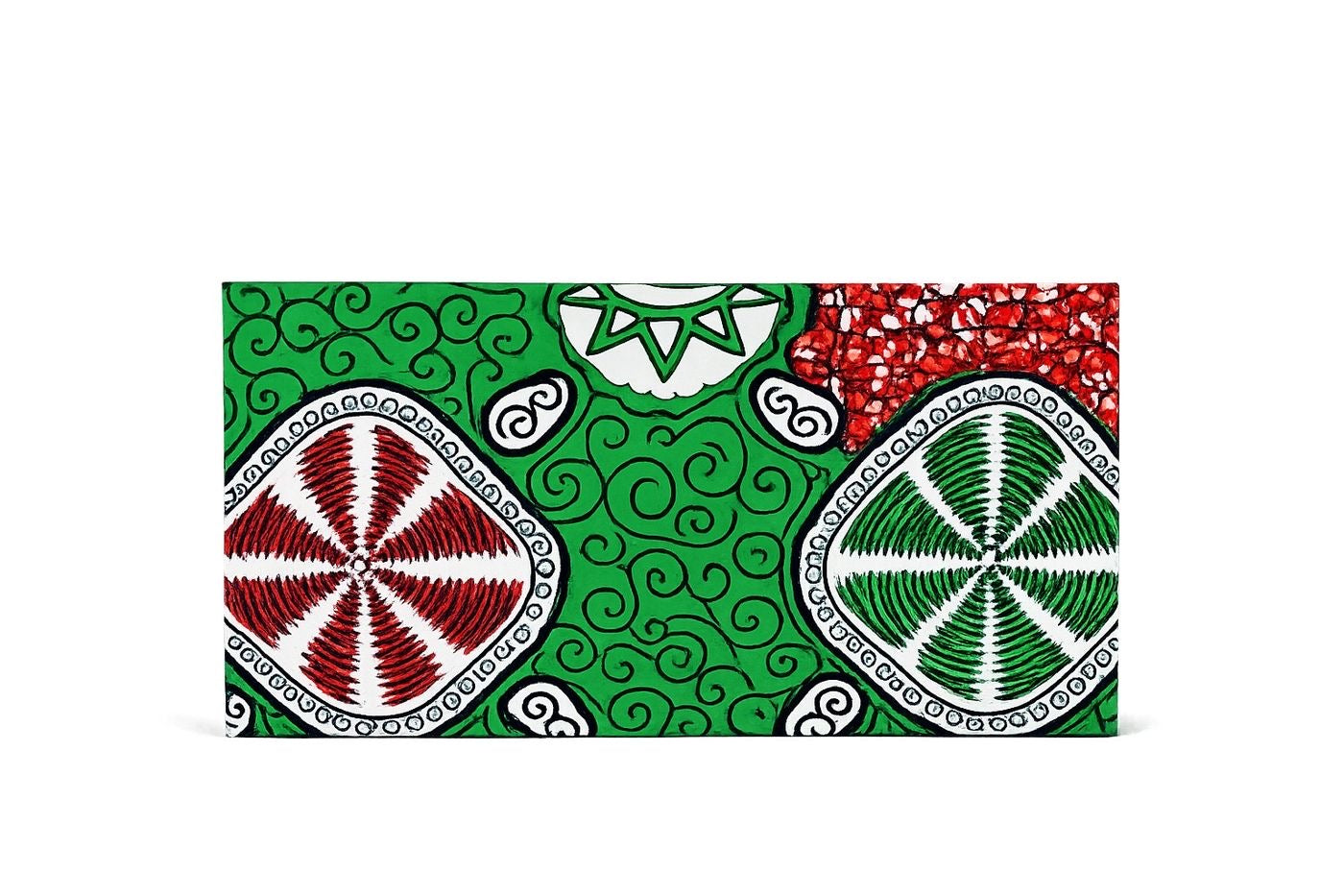 Colorful fabric red, white, and green gift bag with geometric patterns on a white background