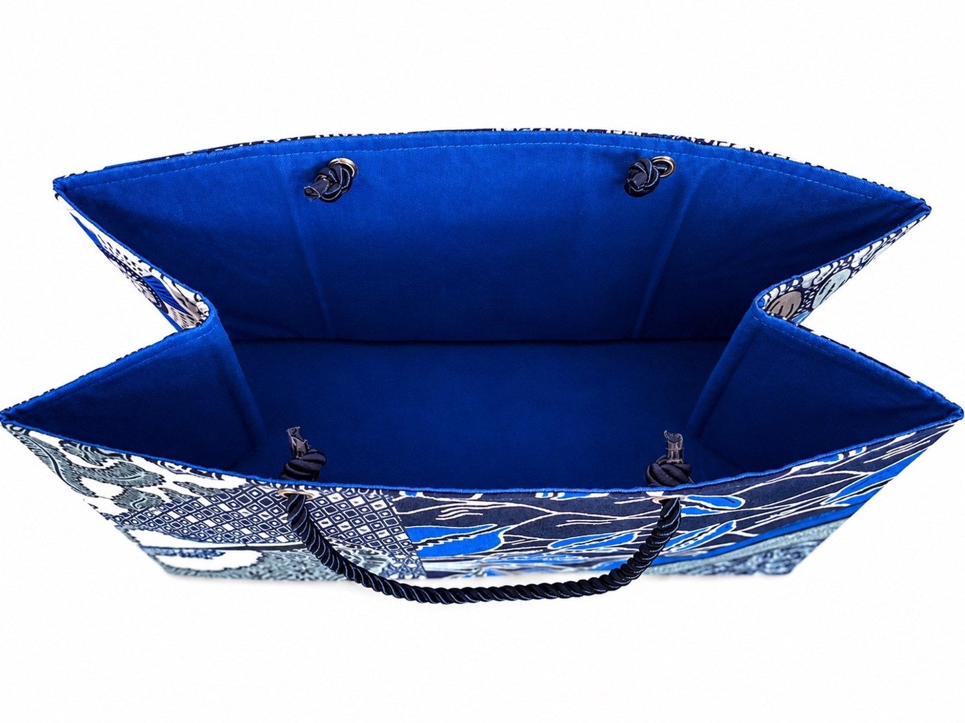 Inside view of a blue, gray, and white fabric horizontal gift bag with floral pattern on a white background