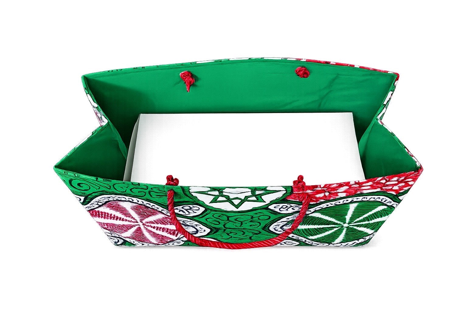 Inside view of a colorful fabric red, white, and green gift bag with geometric patterns on a white background