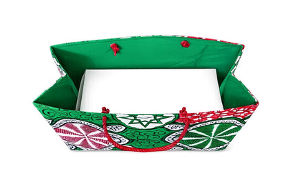 Inside view of a colorful fabric red, white, and green gift bag with geometric patterns on a white background