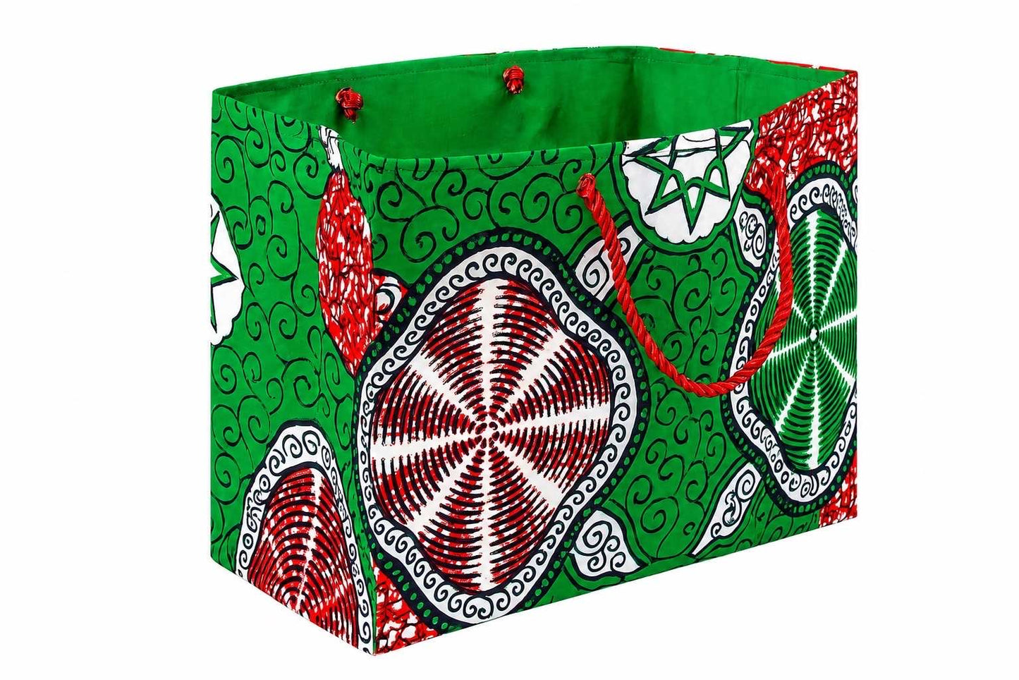 Side view of a colorful fabric red, white, and green gift bag with geometric patterns on a white background