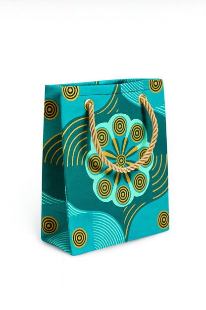 Decorative gift bag with green, dark green, & gold  pattern on a white background