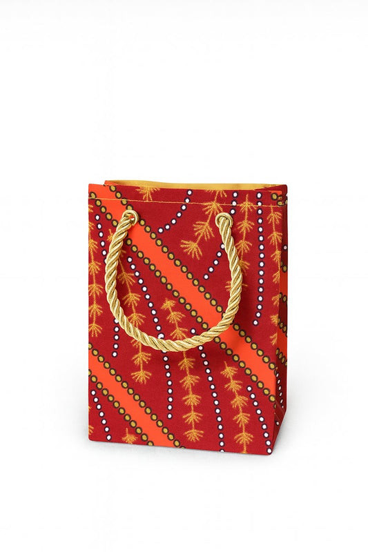 Maroon decorative gift bag with orange, black, & white patterns on a white background