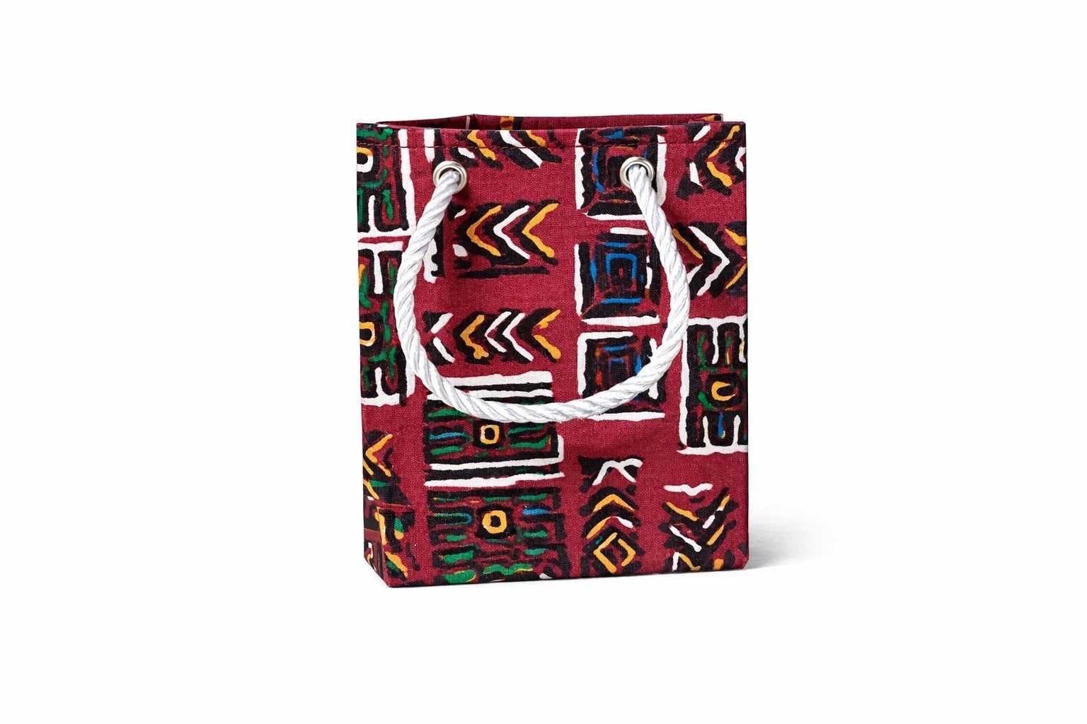 Decorative gift bag with maroon, blue, green, orange, white, & black pattern on a white background