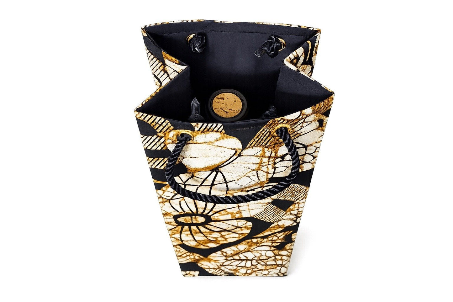 Inside view of a decorative cream, black, and gold wine bottle bag with floral pattern on a white background