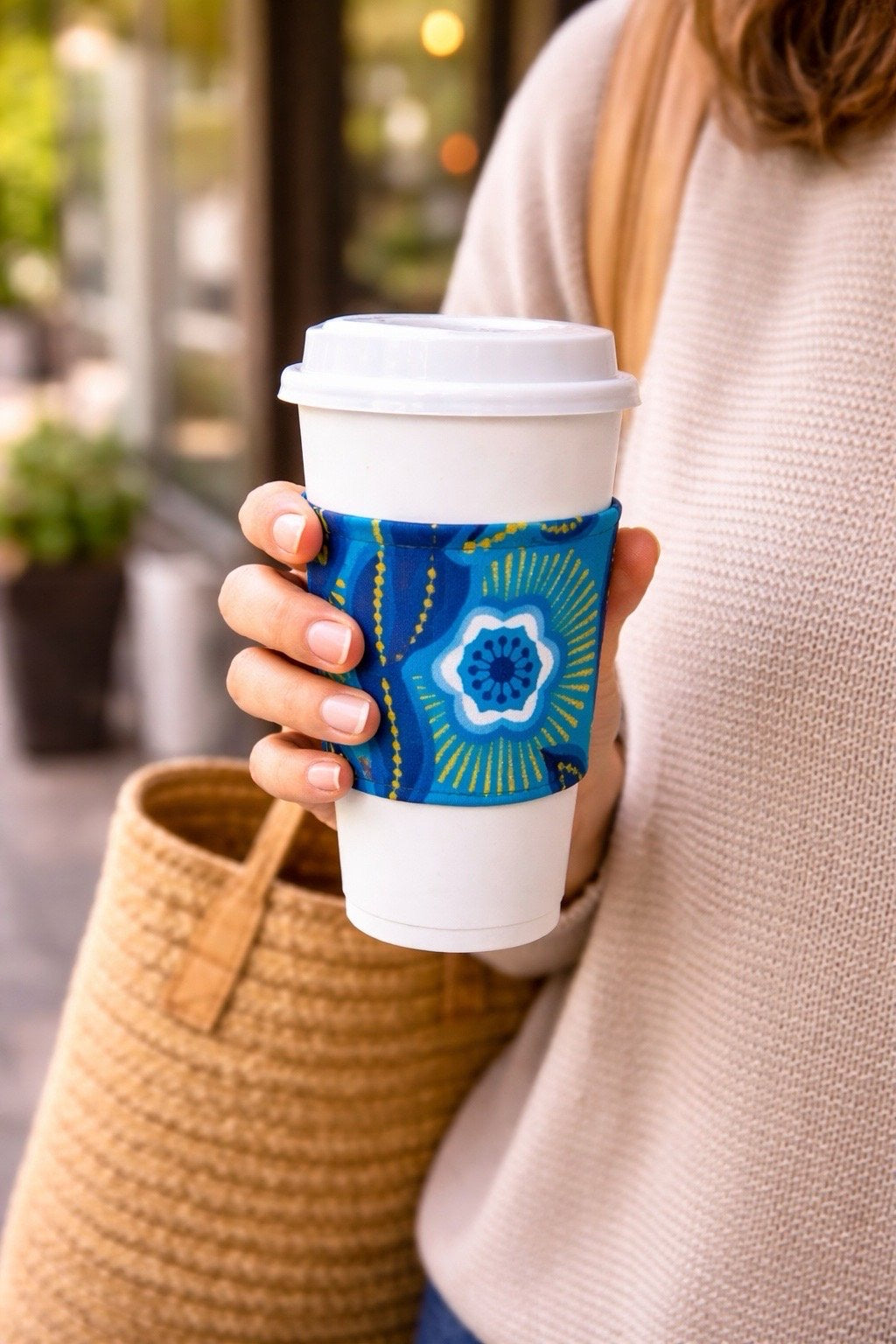Handmade African fabric cup sleeve lifestyle shot