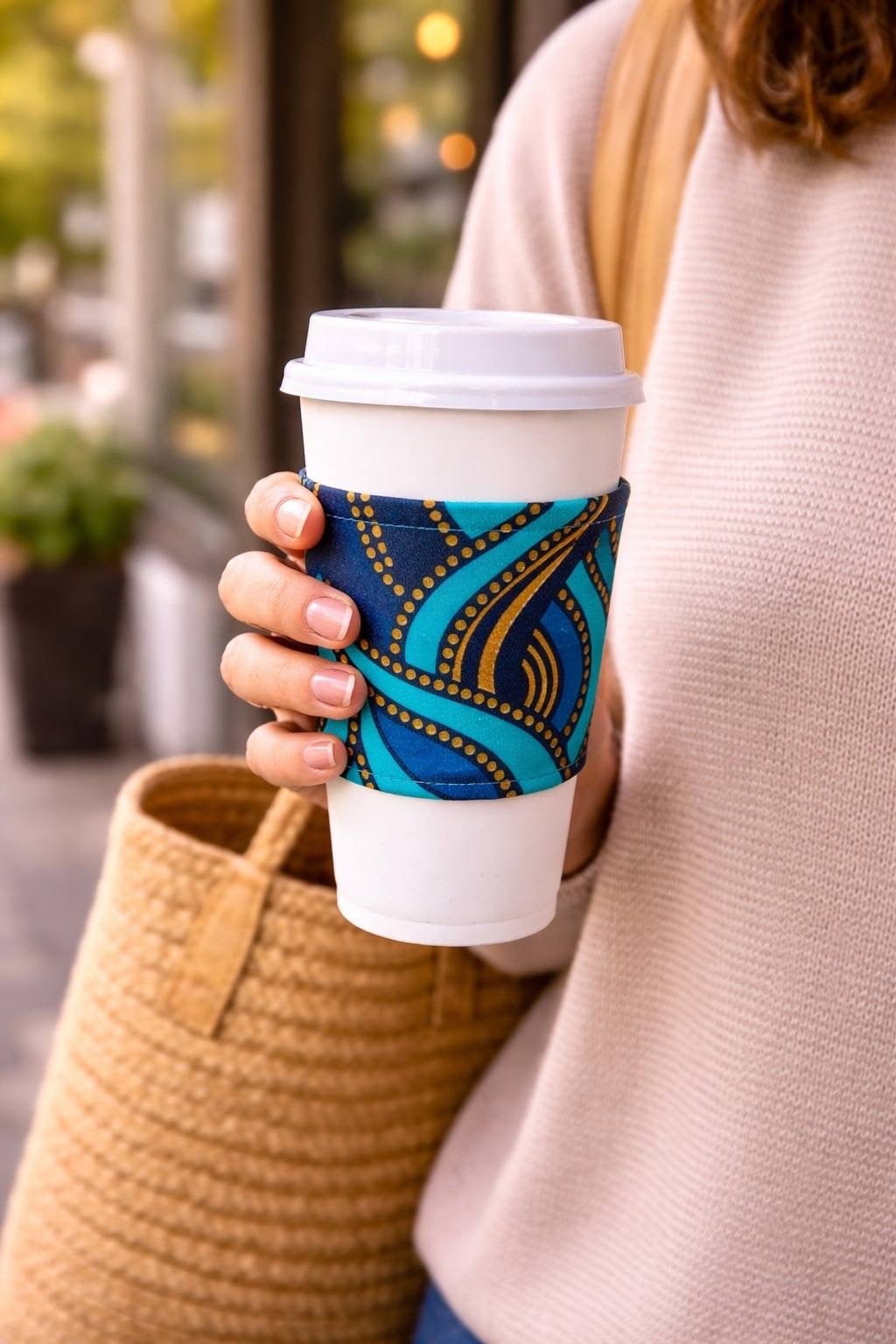 Handmade African fabric cup sleeve lifestyle shot