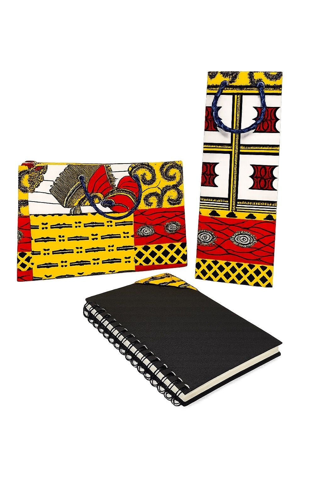 Set of red, white, yellow, and red gift bags and corner bookmark in a spiral notebook with on a white background