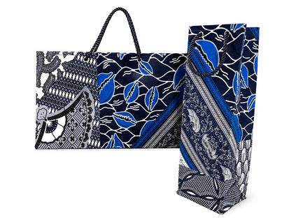 Two patterned gift  bags with blue, gray and white  designs on a white background
