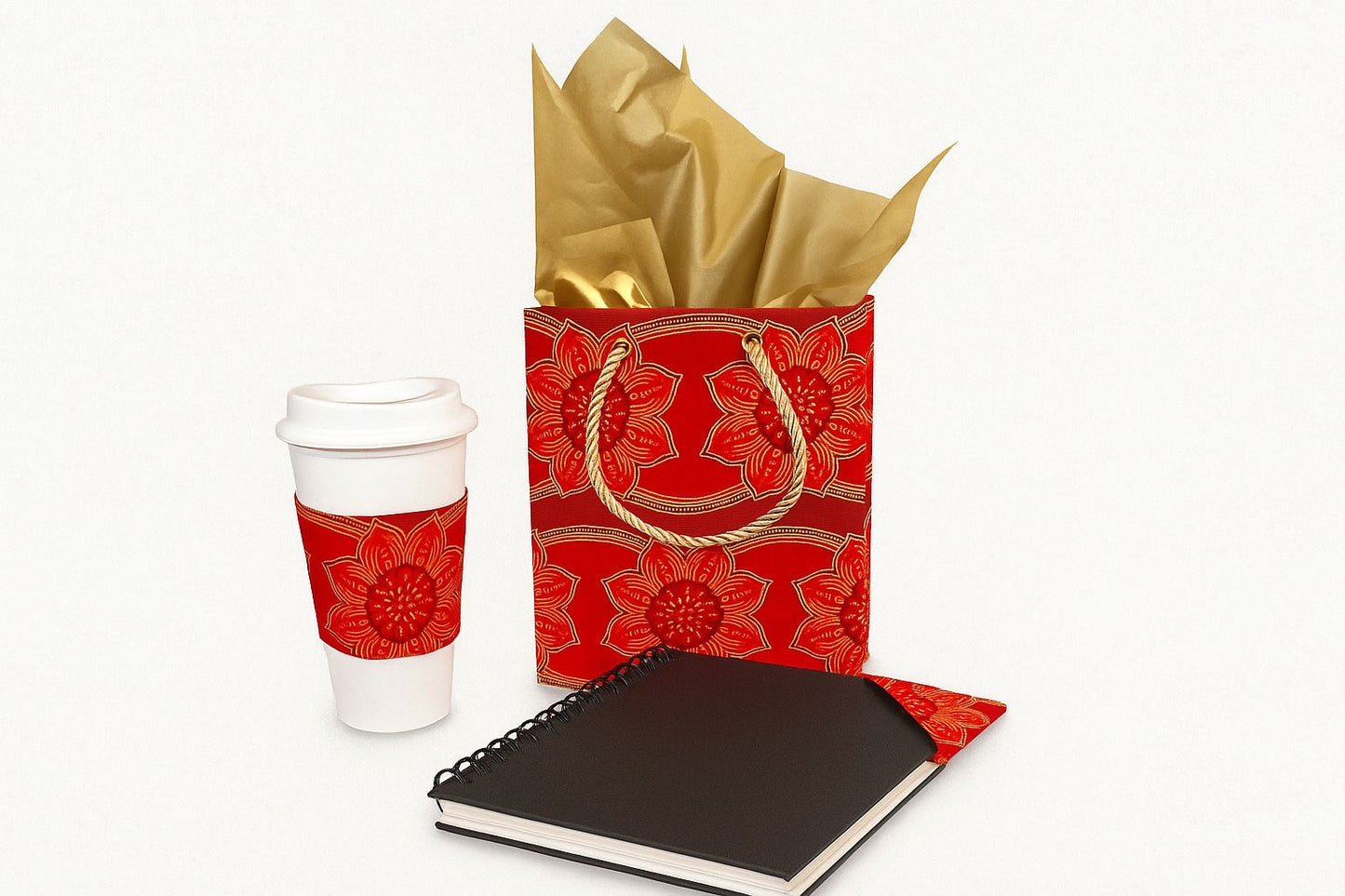 Red and gold cup sleeve, small gift bag, & bookmark on a white background