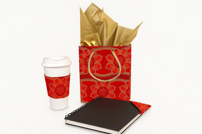 Red and gold cup sleeve, small gift bag, & bookmark on a white background