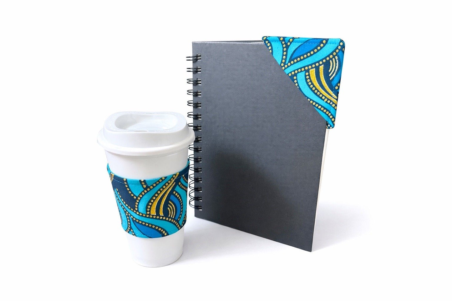 Turquoise, dark blue, & gold cup sleeve & bookmark on a white background