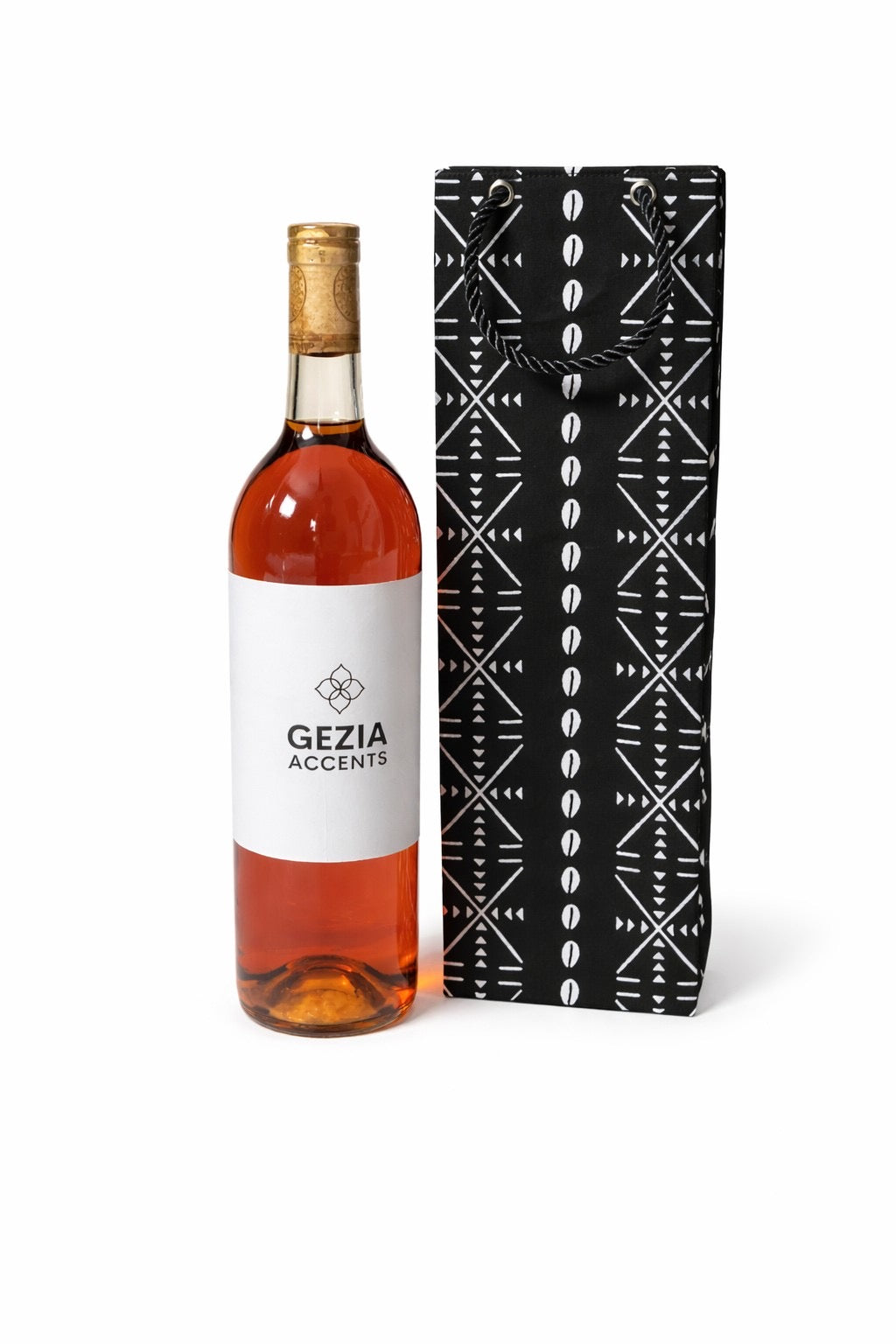 Bottle of wine with a decorative black and white gift bag on a white background
