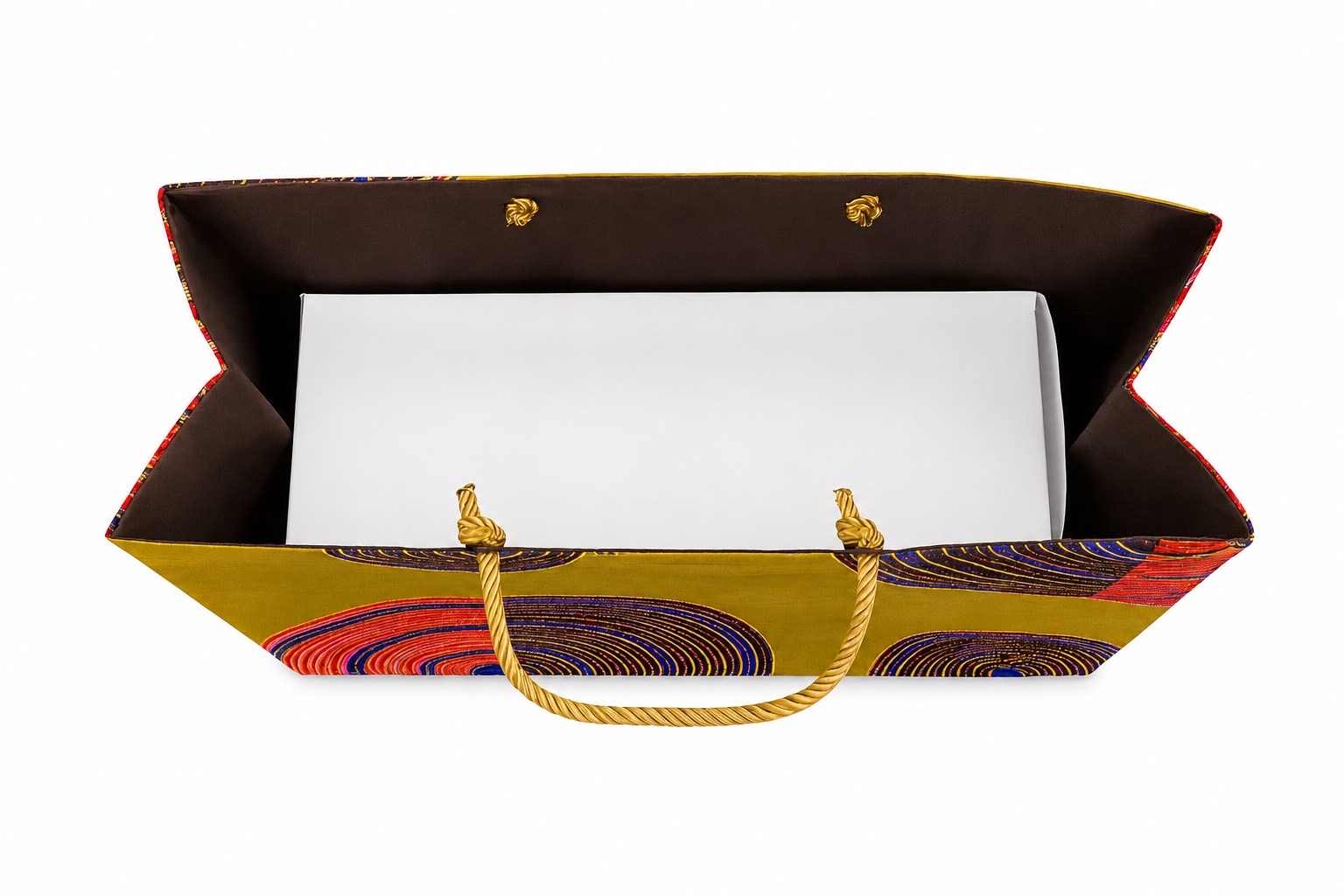 Green, dark brown, blue, red, and gold patterned bag with a white box inside on a white background