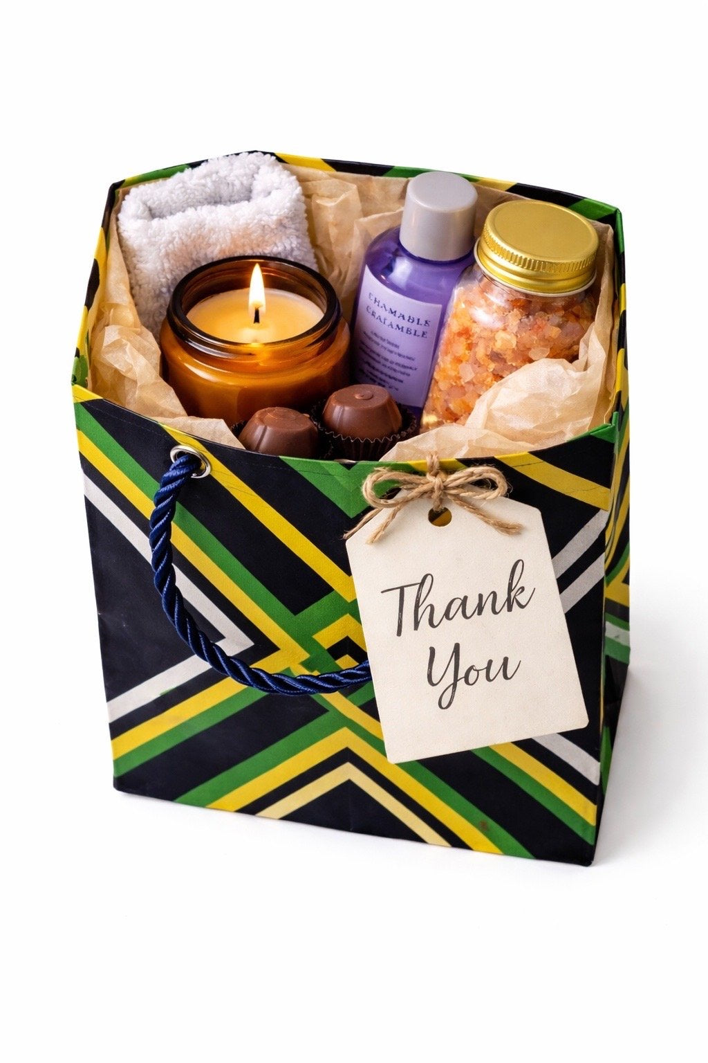 Black, yellow, green, & white extra small gift bag with product ideas inside the bag on a white background
