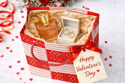 Red, white, & gold extra small gift bag with product ideas inside the bag on a white background
