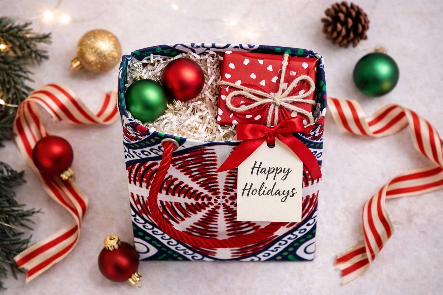 White, green, red, & black extra small gift bag with product ideas inside the bag on a white background