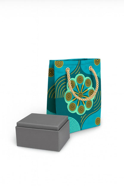 Green, dark green, & gold mini gift bag with product ideas to gift on the side on a white background