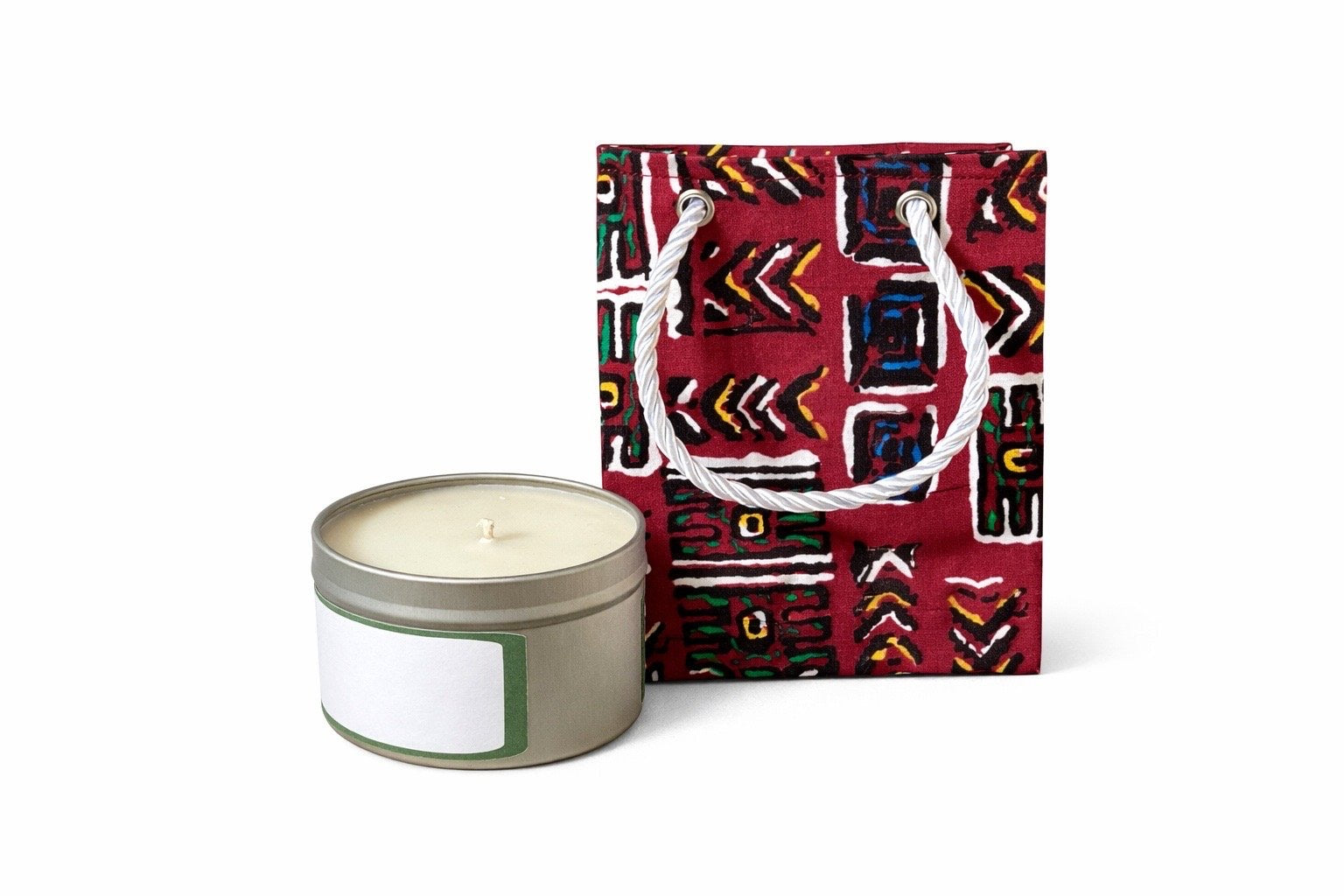 Maroon, orange, blue, green, black, & white mini gift bag with product ideas to gift on the side on a white background