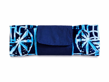 Blue and white market bag with geometric pattern folded in clutch position on a white background