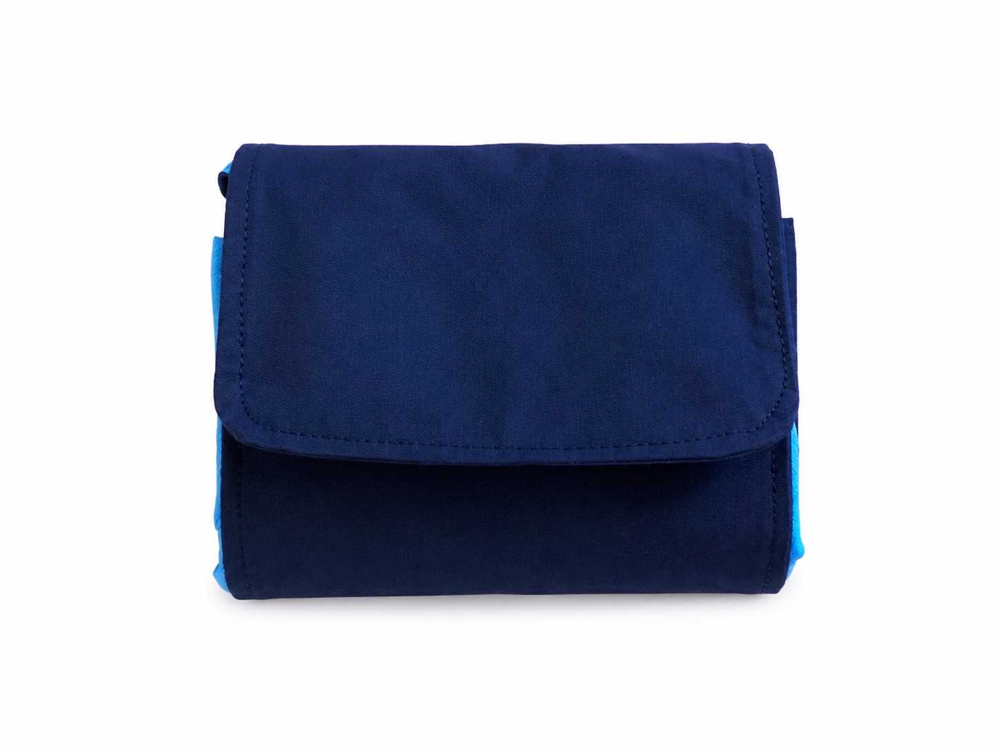 Blue and white fabric market bag folded in pouch position on a white background